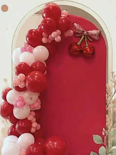 Cherry red, pink and white garland on a red arch