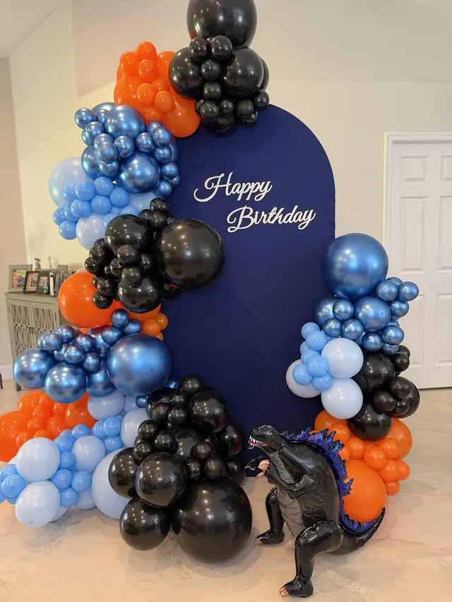 Navy, chrome blue and orange birthday garland with a dinosaur