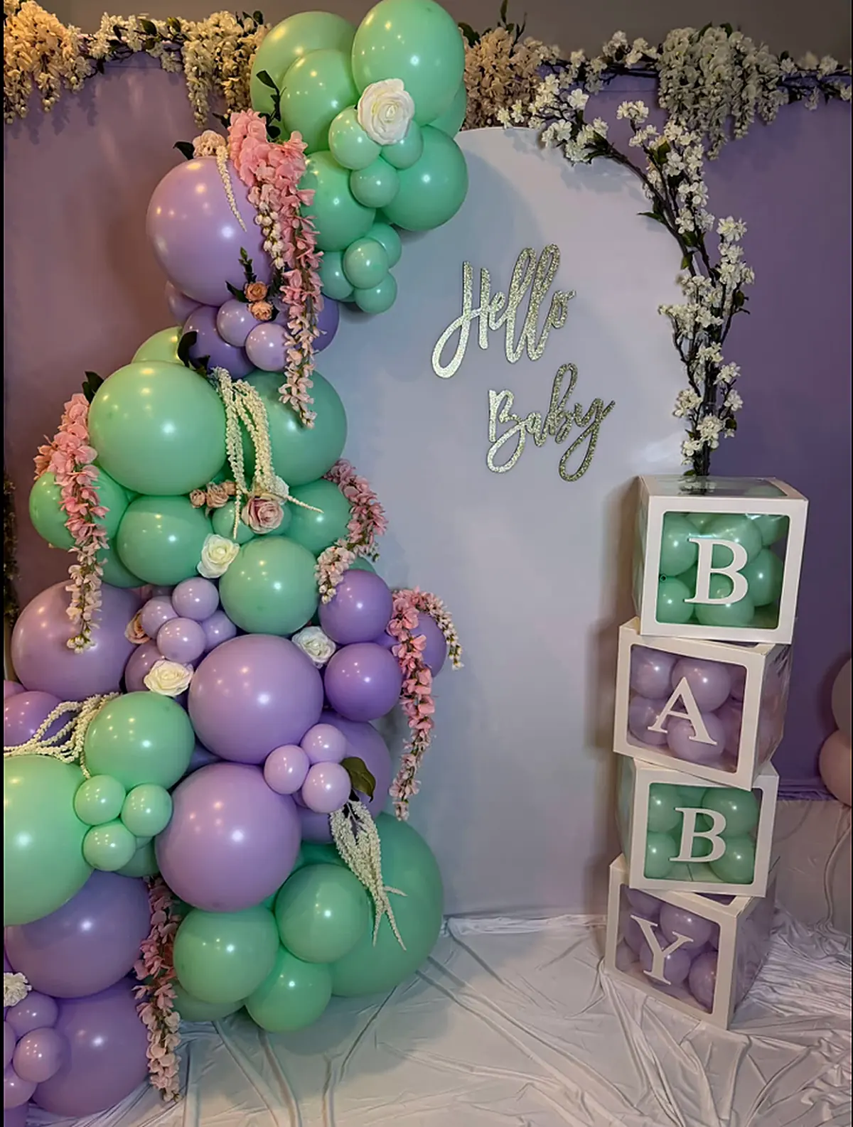 Mint and lilac garland with florals and a Hello Baby sign