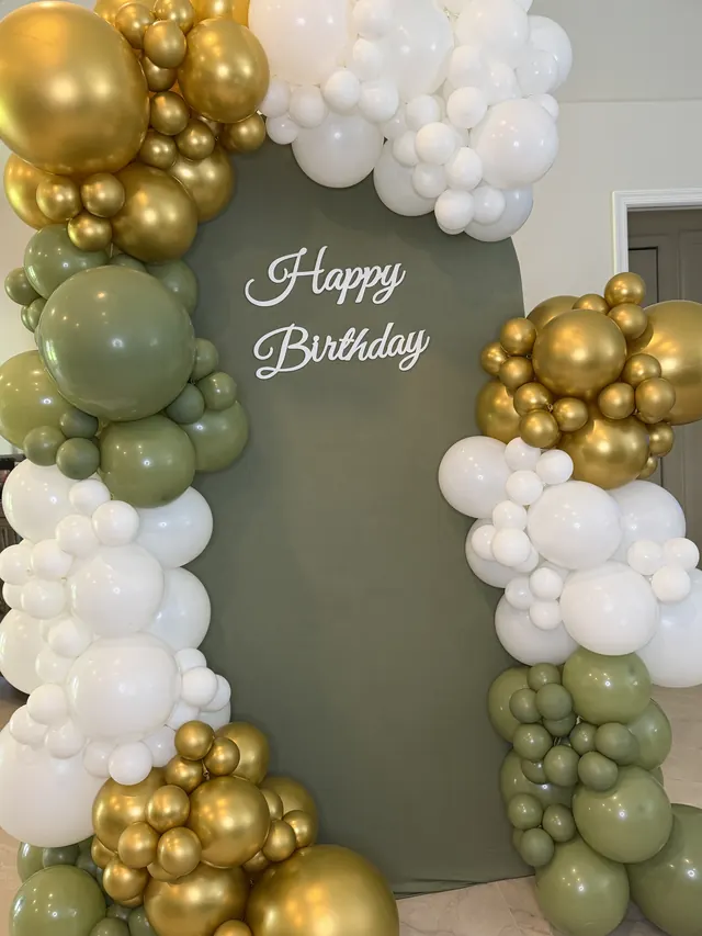 Sage, white and gold garland on an olive arch